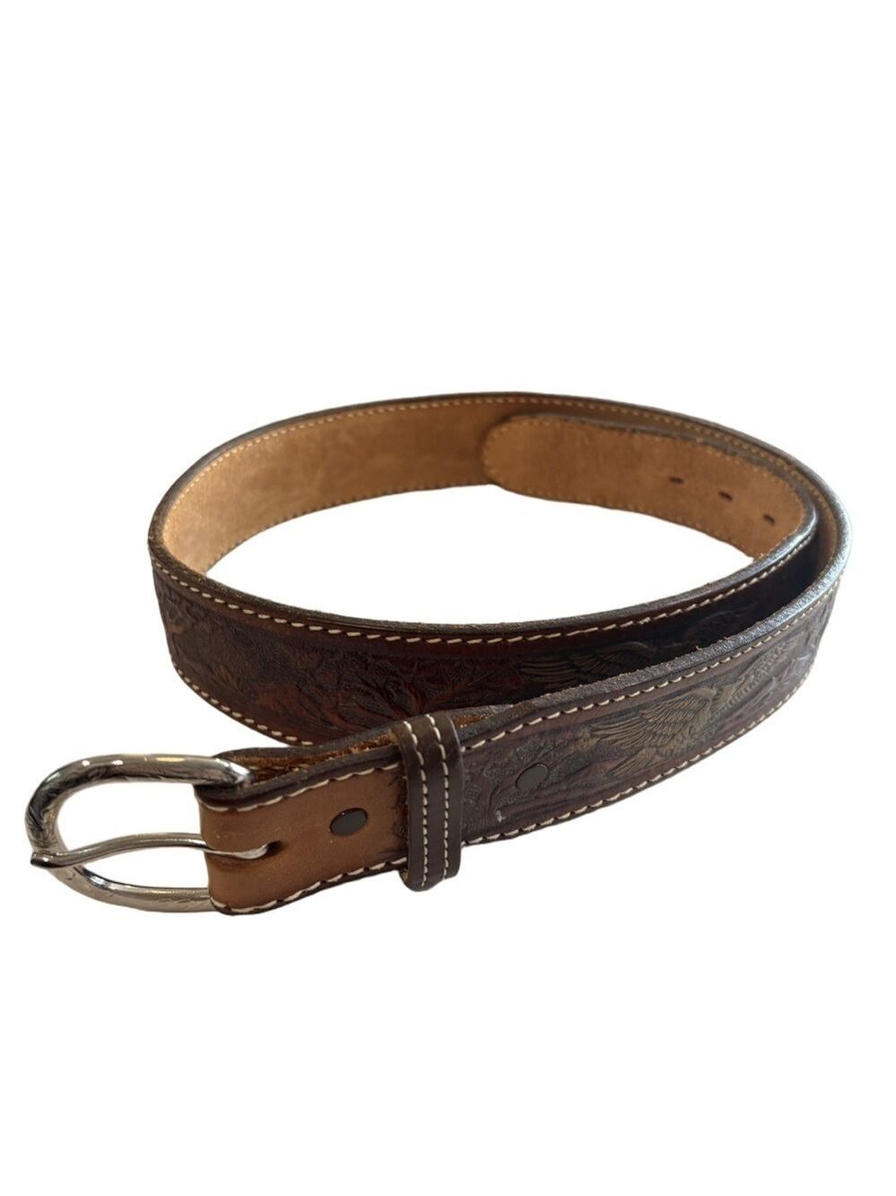 Brown leather belt embossed with American Eagles. Silvertone buckle. Size 39